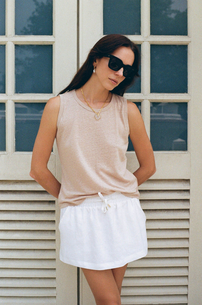 Summery the label's model wearing the classic linen skirt in white