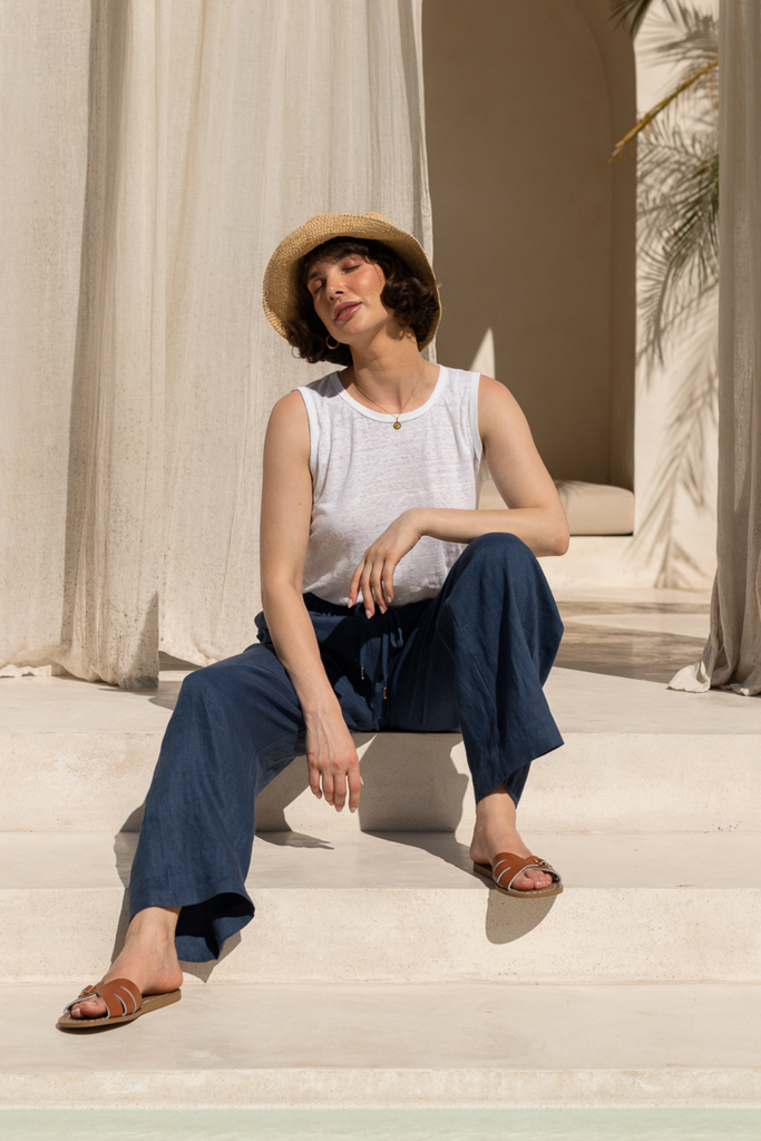 Summery The Label’s navy blue lounge pants made from lightweight linen, styled for relaxed tropical comfort