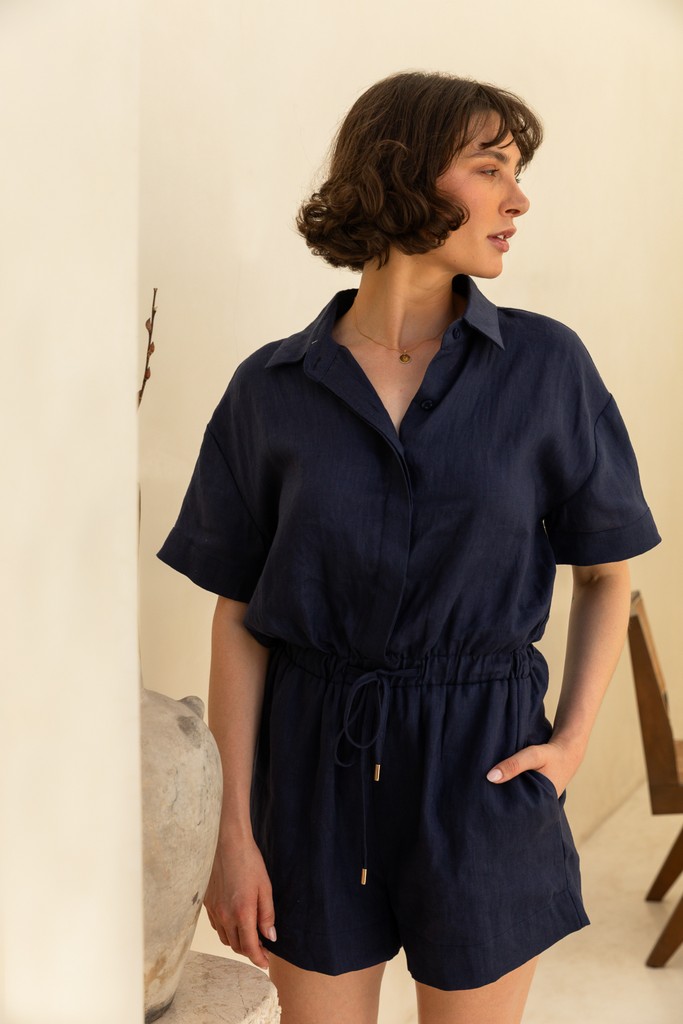 Navy linen playsuit with a relaxed fit by Summery The Label, designed for all-day comfort in warm climates