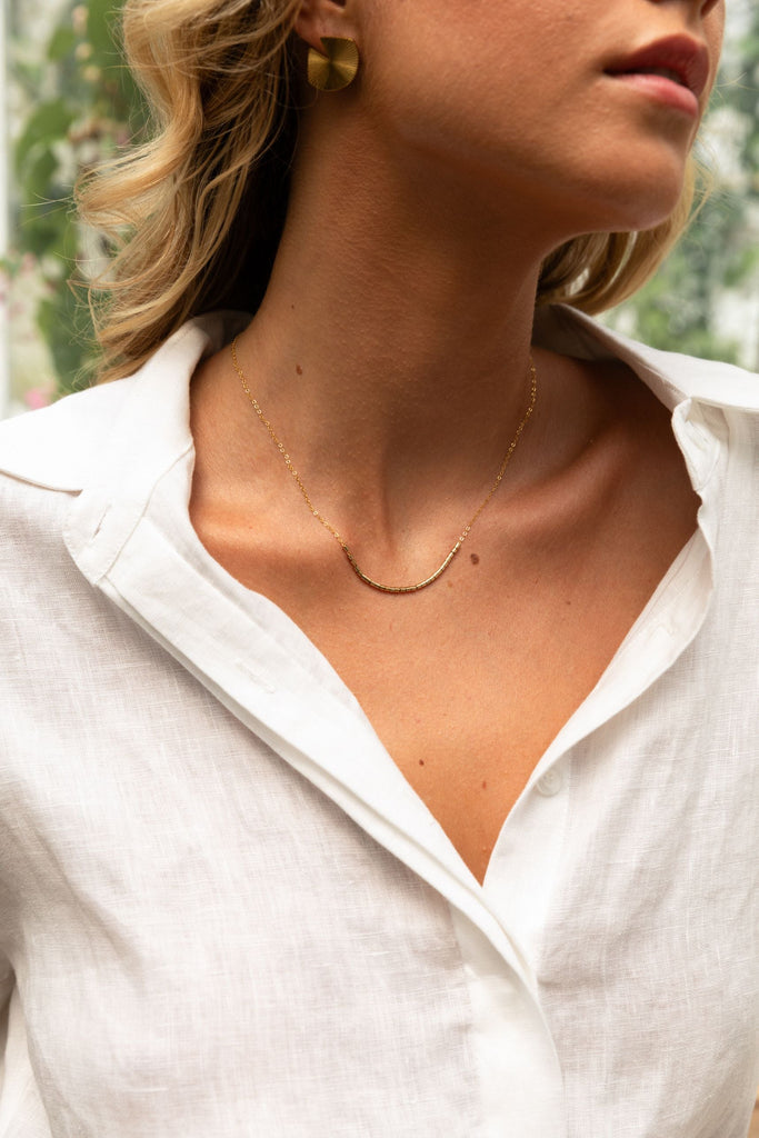 Woman wearing summery the label classic linen playsuit in white