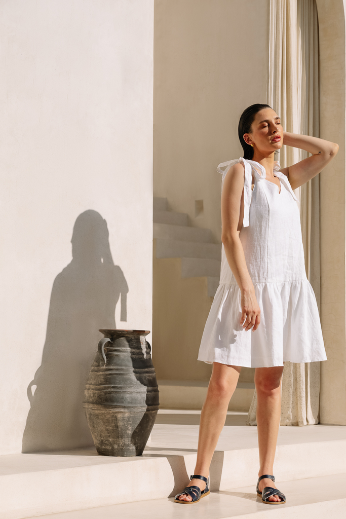 White shoulder-tie dress made from breathable fabric by Summery The Label, ideal for sunny weekends and resort escapes