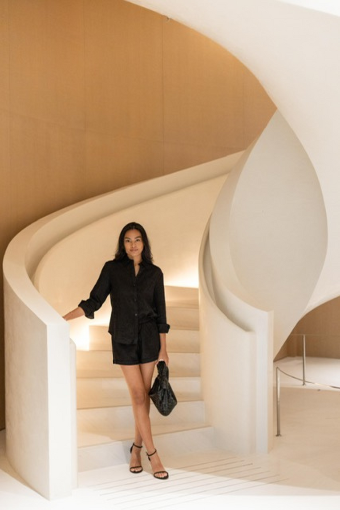 Summery The Label's model wearing the classic linen shorts in black