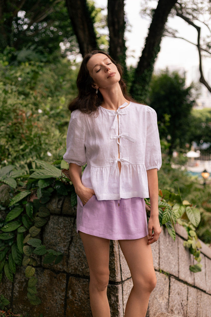 Summery the label's model wearing the classic linen skit in lilac