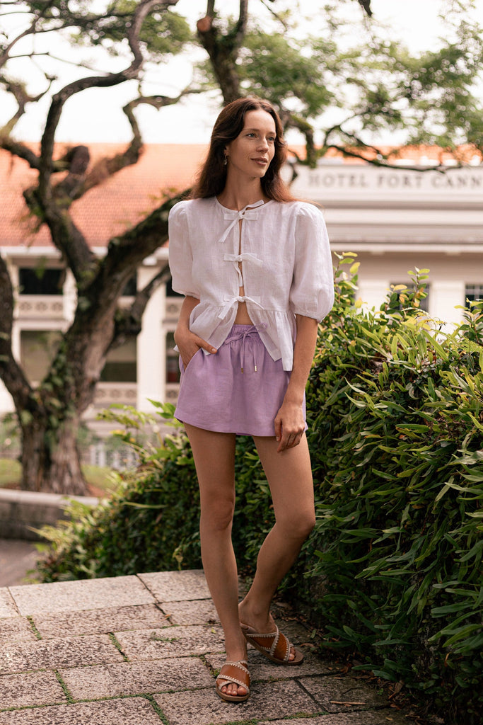 Summery the label's model wearing the classic linen skit in lilac