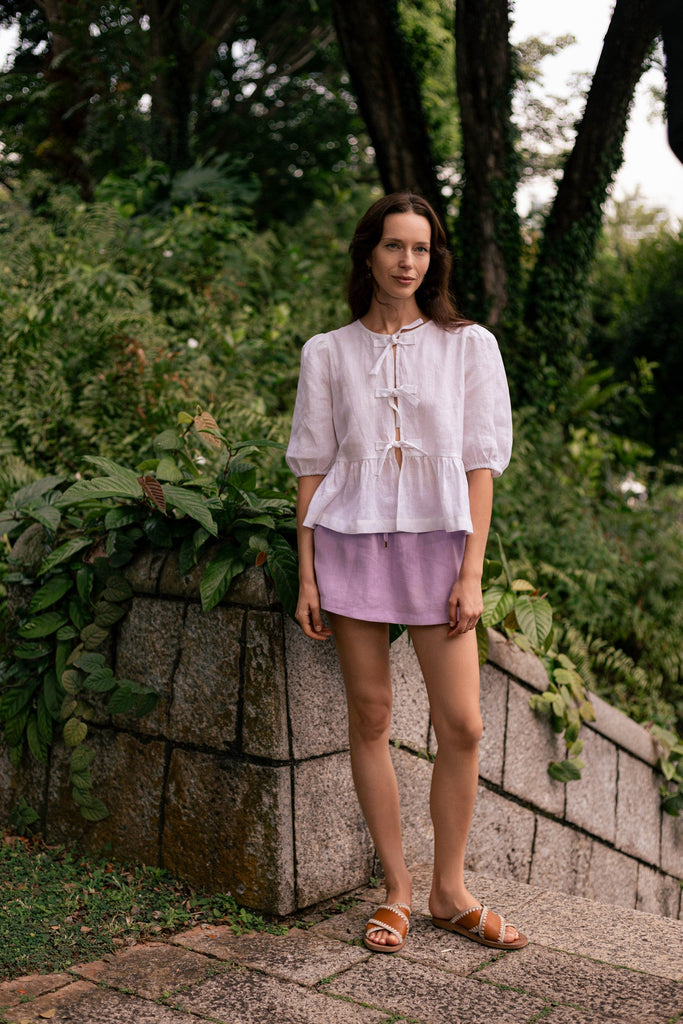 Summery the label's model wearing the classic linen skit in lilac