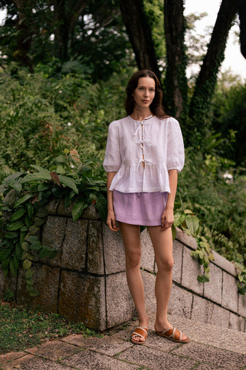 Summery the label's model wearing the classic linen skit in lilac