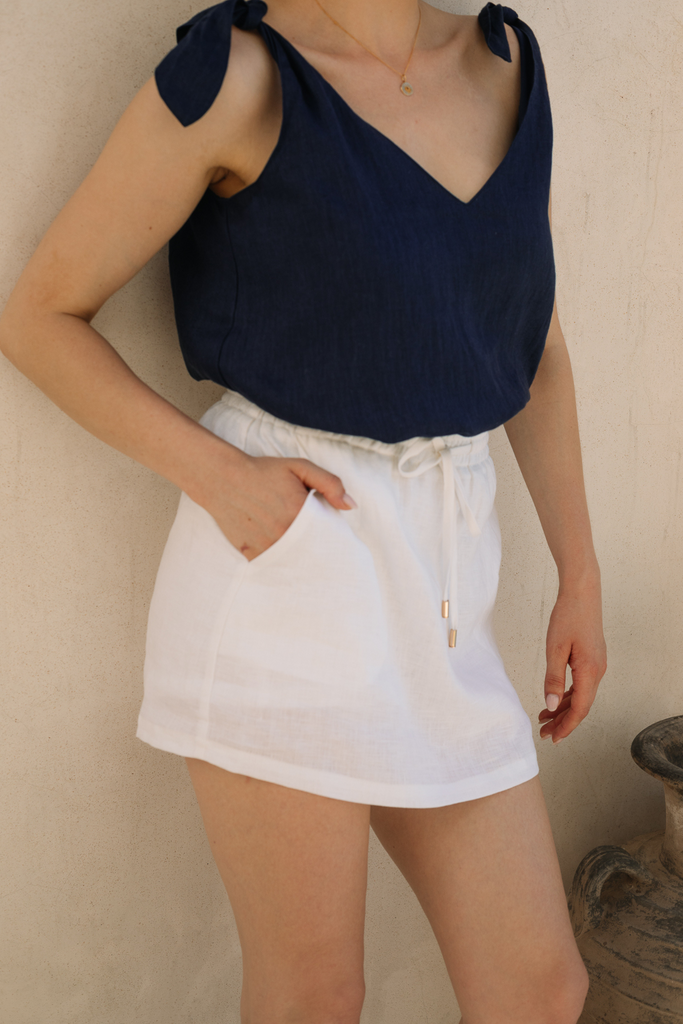 Lightweight white linen skort designed by Summery The Label for breathable comfort and minimalist charm