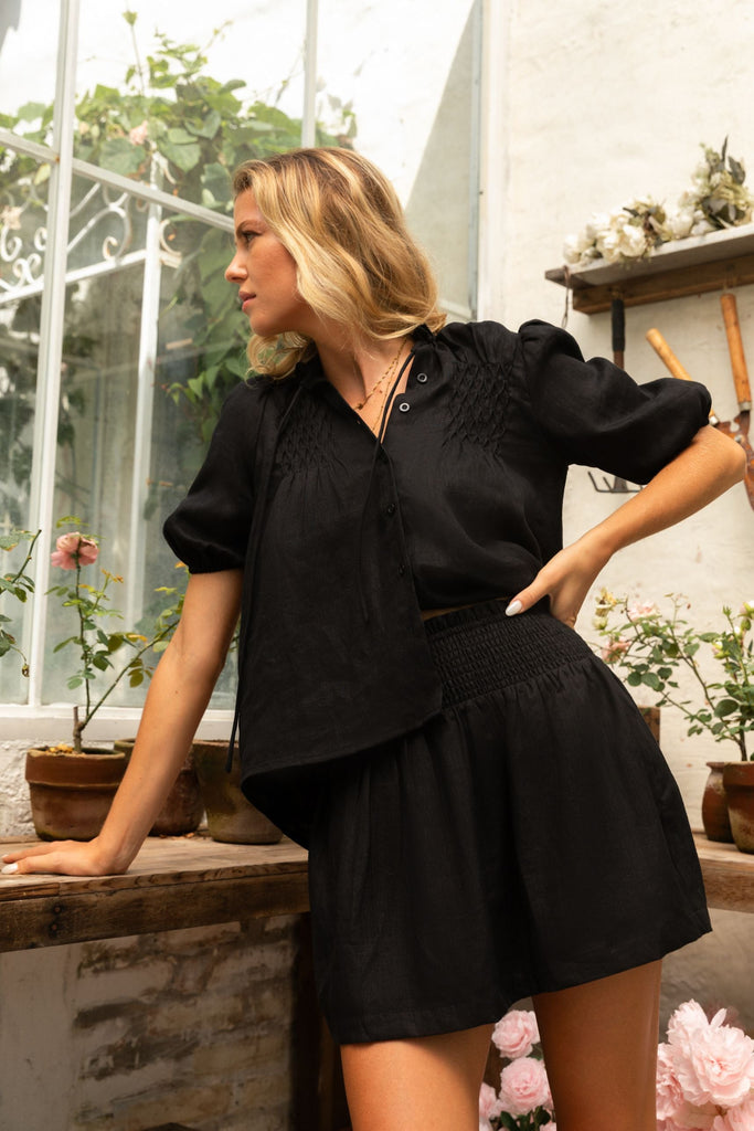 Summery the label model wearing the classic linen smock blouse top in black