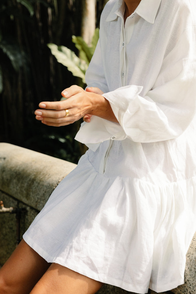 Model in classic linen drop waist dress in summery white