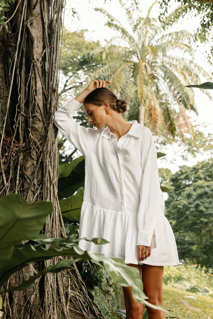 Model in classic linen drop waist dress in summery white