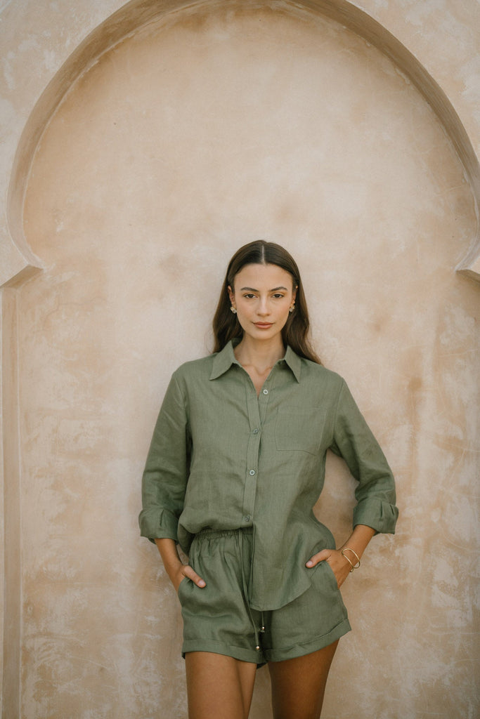 Model wearing the classic linen shorts in khaki green