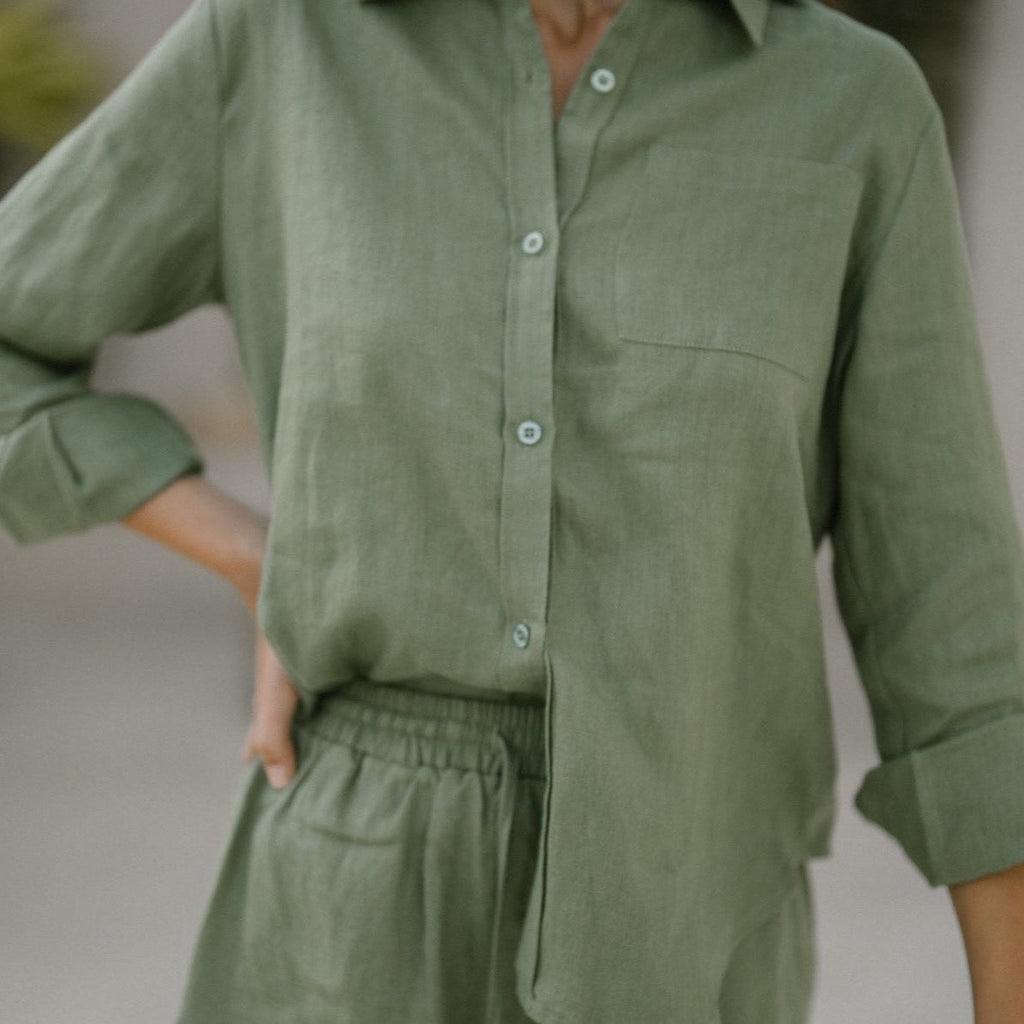 Model wearing the classic linen shorts in khaki green