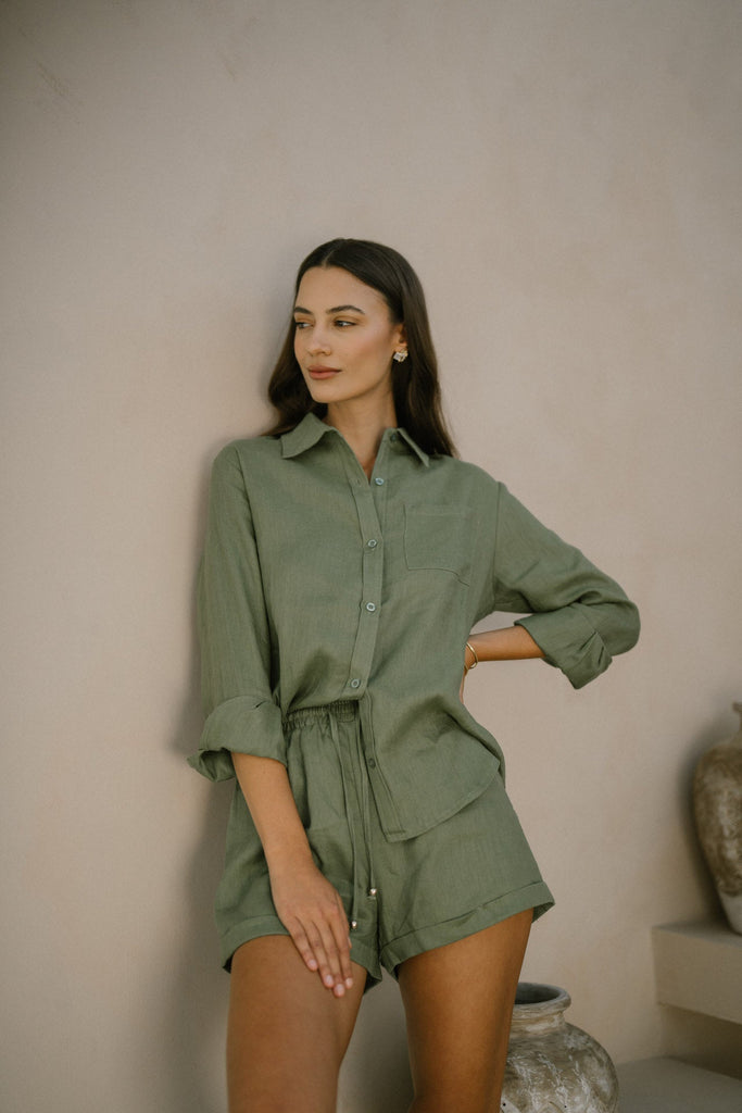 Model wearing the classic linen shorts in khaki green