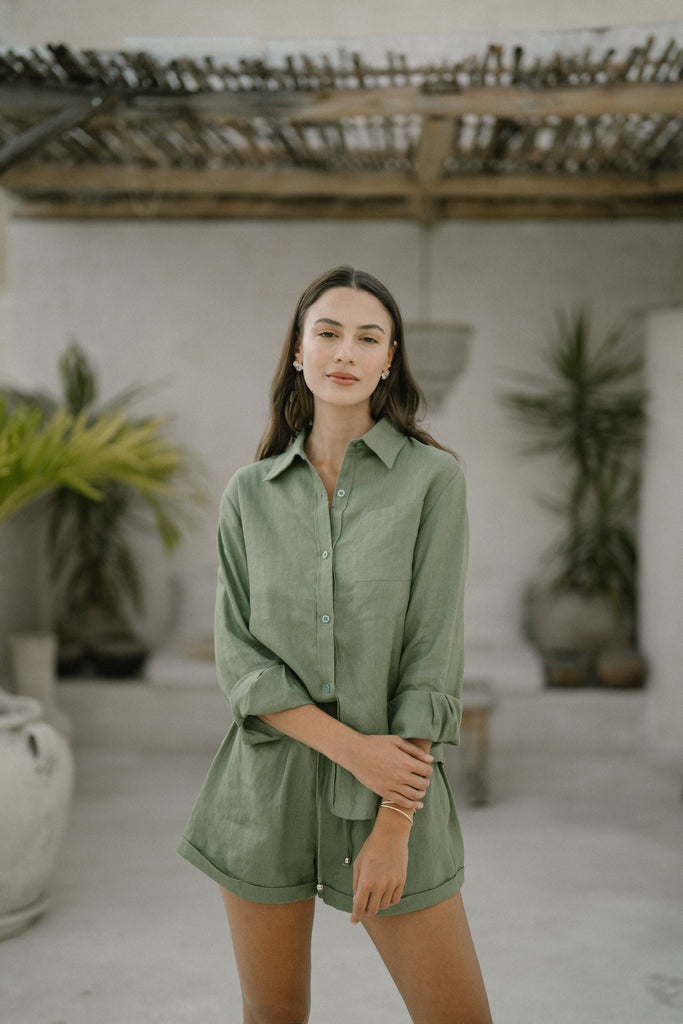 Model wearing the classic linen shorts in khaki green
